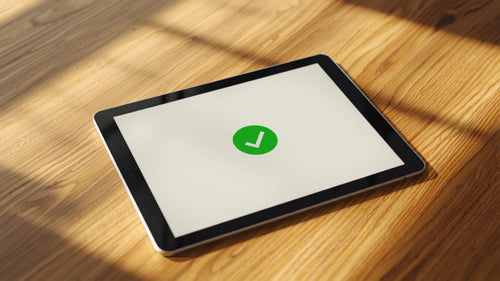 Order tracking screen on tablet with green checkmark confirmation, representing post-purchase order editing for Shopify merchants