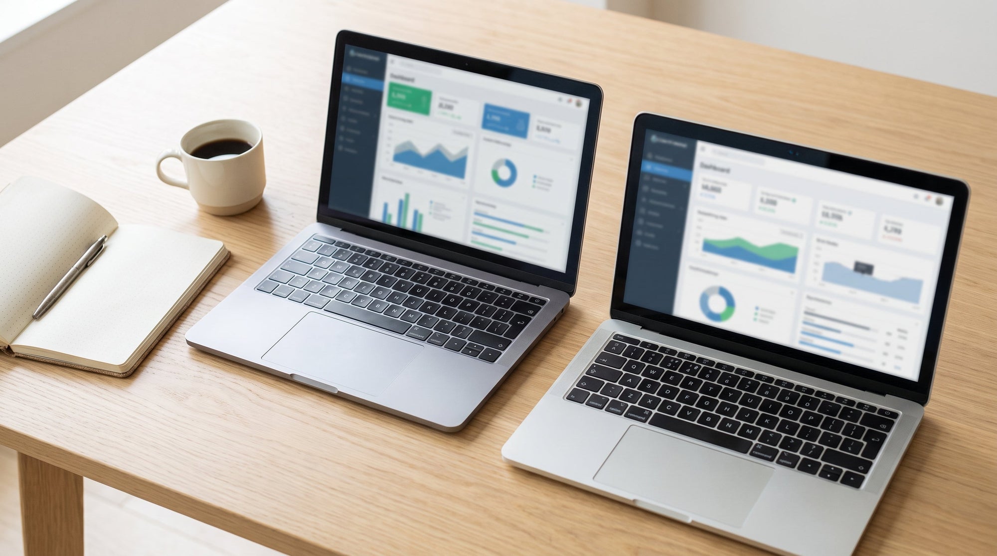 Two laptops open side by side for a platform comparison, representing evaluating shipping guarantee software options.