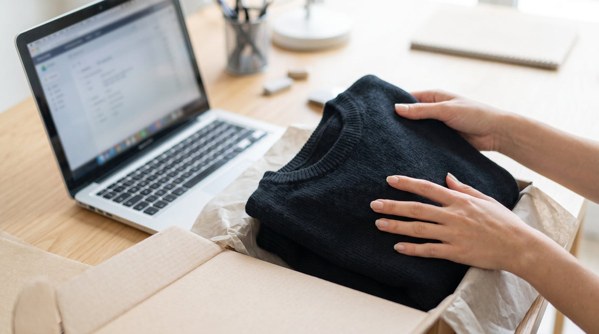 A returned product on a desk beside a laptop, representing choosing the right resolution for each return.