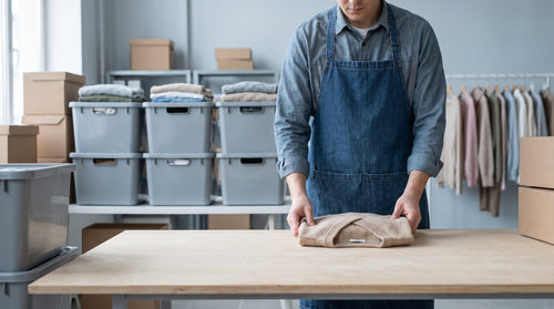 Apparel returns being processed in a warehouse, representing lower return costs for apparel brands.